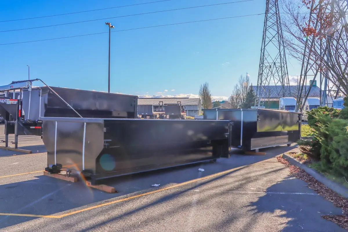 Roll-off dumpster ready for waste disposal at job site for 2 Yard Dumpster Rental in Kennebunk